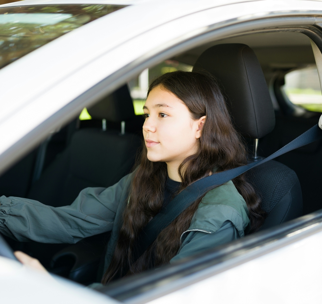 Recently passed driver enjoying driving freedom.
